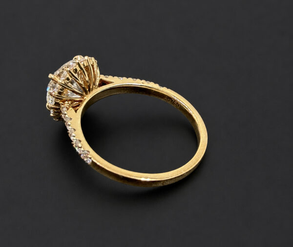round-halo-engagement-ring-with-pavé-band